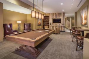 a billiard room with a pool table and chairs at Avon Resort 2BR Suite in Avon