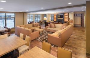 a living room with couches and a dining room at Avon Resort 2BR Suite in Avon