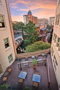a view of a balcony with tables and chairs at Riverside Suites Resort 1BR Apartment in San Antonio