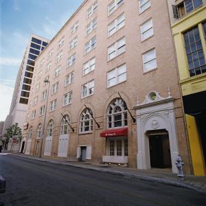 a brick building on the side of a street at Riverside Suites Resort 1BR Apartment in San Antonio +13 photos