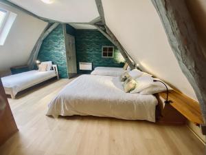 a bedroom with a bed with a dog laying on it at Les Gîtes de Leymandie in Saint-Avit-de-Vialard +39 photos