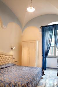 Postel nebo postele na pokoji v ubytování Albergo L'Antico Convitto