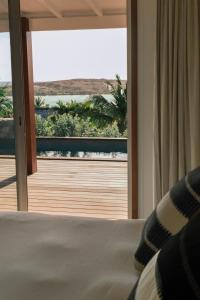 a bedroom with a bed and a view of a window at 3 Bedroom Villa with Lagoon View Pool in Marigot +84 photos