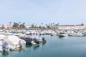 a bunch of boats are docked in a harbor at HI Faro – Pousada de Juventude in Faro