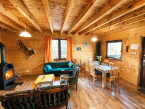 a living room with a couch and a stove at Orla Chata Baltic House in Świnoujście