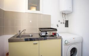 Kuchyňa alebo kuchynka v ubytovaní Apartman Prima