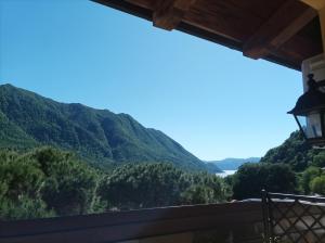 a view of the mountains from the balcony of a house at Bed and Breakfast da Pio in Castelveccana