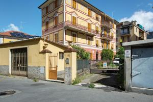 a building with a gate in front of a street at Casa Mia in Rapallo