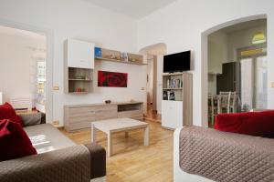 a living room with two couches and a table at Casa Mia in Rapallo