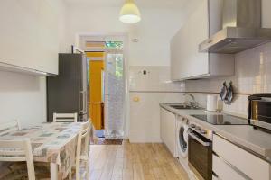 a kitchen with a table and a dining room at Casa Mia in Rapallo