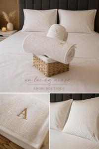 an image of a bed with towels on it at Adori Apartment in Eforie Nord