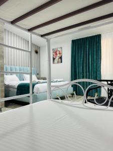 a hotel room with a bed and a bedroom at City Star Kutaisi in Kutaisi