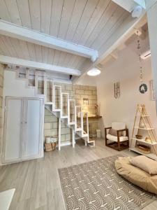 a room with a loft with ladder and shelves at Home Sereia in Trebisacce +21 photos