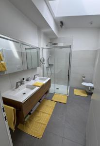 a bathroom with a sink and a shower at Au 10 in St. Wolfgang +37 photos