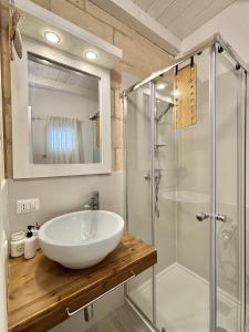 a bathroom with a sink and a shower at Home Sereia in Trebisacce