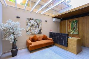 a living room with a couch and a table at Elite Boutique Hotel in Cairo