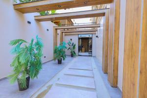 a hallway with potted plants in a building at Elite Boutique Hotel in Cairo