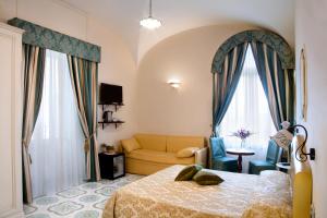 A bed or beds in a room at Albergo L'Antico Convitto