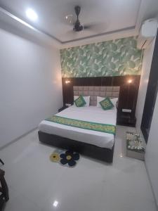 a bedroom with a large bed in a room at Hotel Toss n Sipp Powai in Mumbai