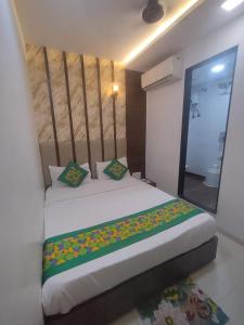 a bedroom with a large bed in a room at Hotel Toss n Sipp Powai in Mumbai