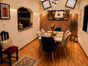 a dining room with a table and chairs at dar leena in Essaouira +27 photos