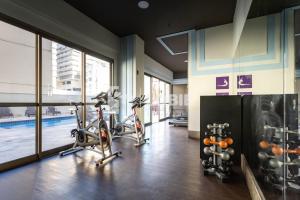 a gym with two exercise bikes in a room at Lobie Botafogo Privilege in Rio de Janeiro