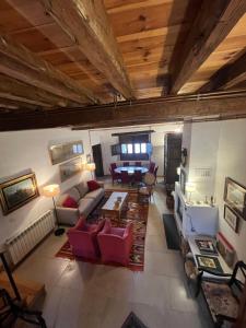 an overhead view of a living room with red furniture at La Fernandina in Riaza