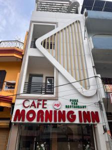a building with a sign for a cafe morning inn at MorningInn in Prayagraj