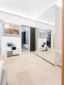 a living room with a large glass wall at Luxury Way Blue Essence in Molfetta