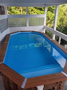 an overhead view of a swimming pool on a porch at Résidence LE LATANIER in Sainte-Anne