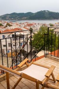 a balcony with a view of a city at L anima II in Skiathos