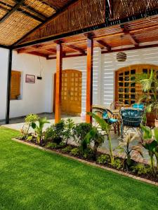 a house with a patio with a table and chairs at Modern Villa in Dahab in Dahab