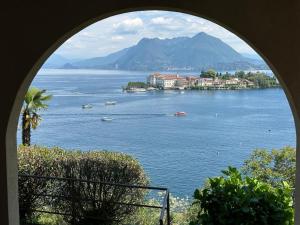 a view of a large body of water with boats at VistaBellaBorromeoFlat in Baveno