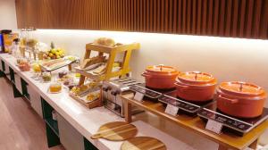 a kitchen with a counter with some pots and pans at Maytaq Wasin Boutique Hotel in Cusco