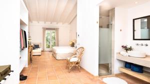 a corridor of a room with a bedroom and a bed at Finca Son Miranda in Sencelles