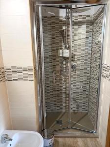 a bathroom with a shower and a sink at B&B Sunset Suite Belvedere in Sant'Agata de' Goti