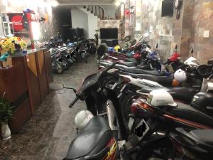 a row of motorcycles parked in a room at Gia Han Guesthouse in Vung Tau
