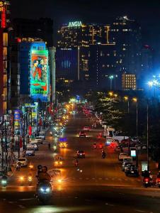 a city street at night with cars and lights at Gia Han Guesthouse in Vung Tau