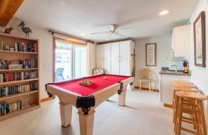 a living room with a pool table in it at Pelican Watch - Kitty Hawk MP 3, 16 Yards to Beach, Ocean View, Pool, Hot Tub, Pool Table, Flex Stays in Kitty Hawk