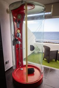 a glass machine with a broom in a room at Live Puertito Neptune Beach in Puertito de Güímar