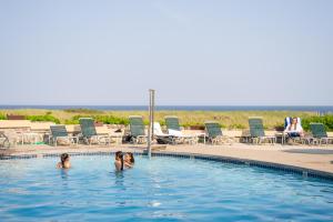 two girls in the swimming pool at a resort at Sea View Inn in Old Orchard Beach +15 photos