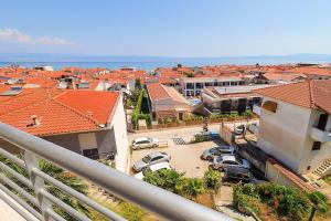 a view of a city with cars parked in a parking lot at Kai Guest House in Polychrono