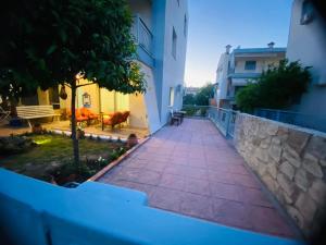 a walkway in the middle of a building at Apartment Jorgo Kalithea in Kallithea Halkidikis