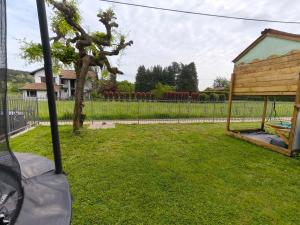 a yard with a gazebo and a fence at Casa Buda 1BR Apartment - Lakes Malpensa MXP 24h Check-in Parking in Sesto Calende