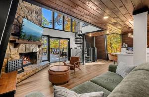 a living room with a couch and a fireplace at Soakin Up The Views in Gatlinburg