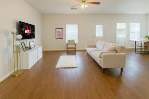 a living room with a couch and a tv at 102 Cecil Cir 3BR2 House in Calera