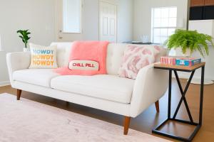 a white couch in a living room with a table at 102 Cecil Cir 3BR2 House in Calera
