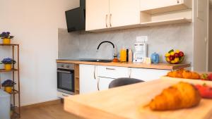 a kitchen with a table and a counter top at Apartment Eva Hvar in Hvar