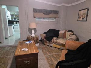 a living room with a couch and a table at 5Res Stay in Queenstown