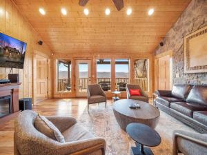 a living room with a couch and a table at Eden's View in Gatlinburg